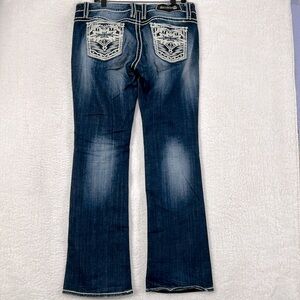 Studio 5 embroidered pocket, heavy stitch, darker wash boot cut jeans size 32